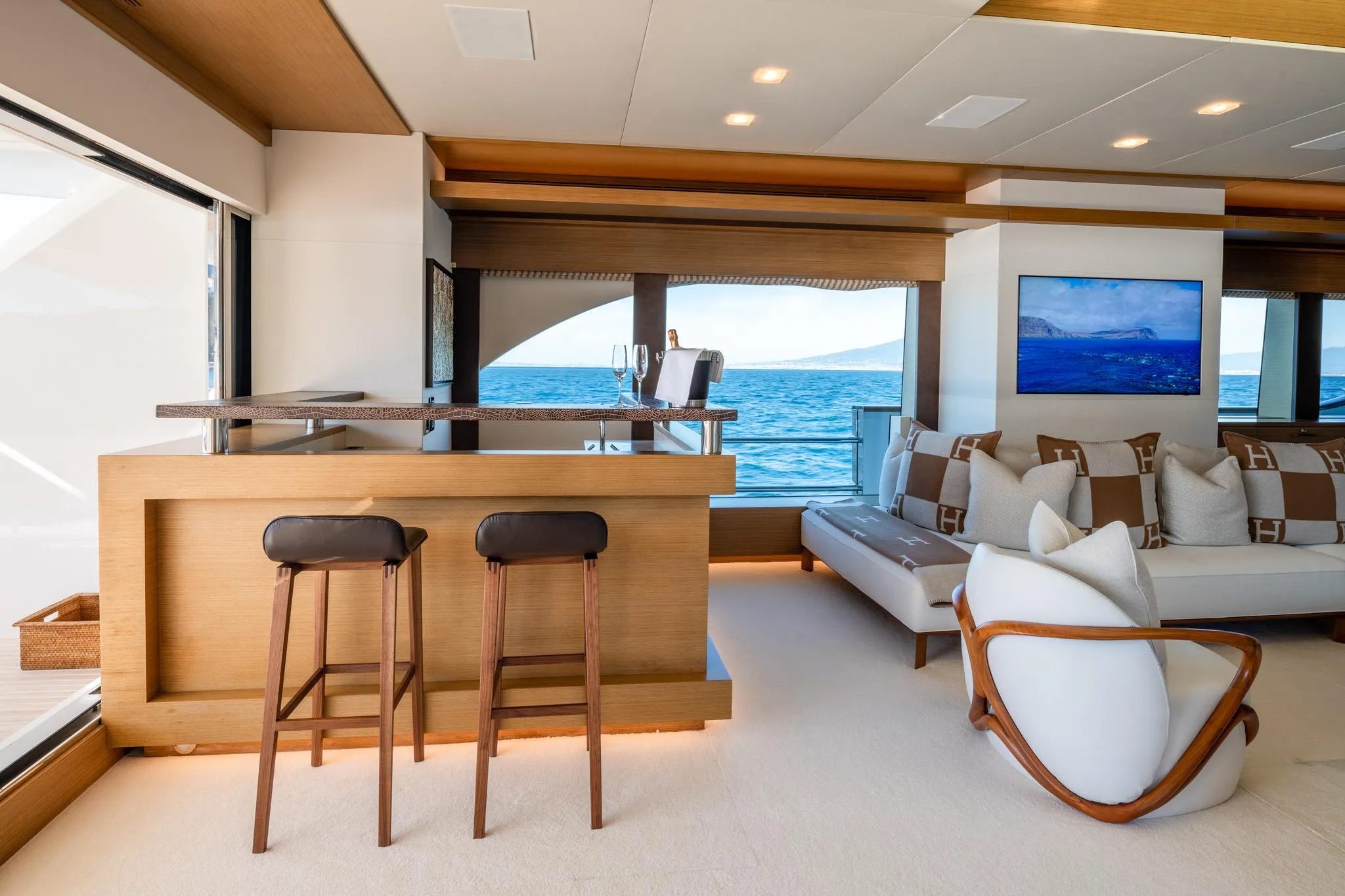 Luxurious yacht interior with bar, seating, and ocean view, custom design, 2008 model.
