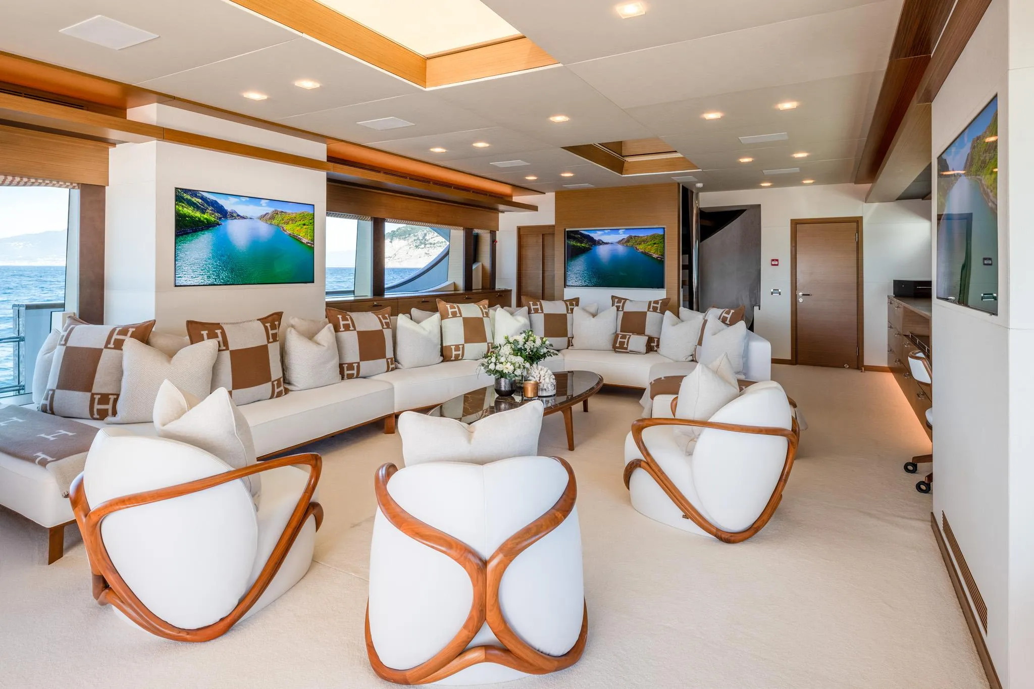 Luxurious yacht interior with modern seating, elegant decor, and scenic views, custom model 2008.
