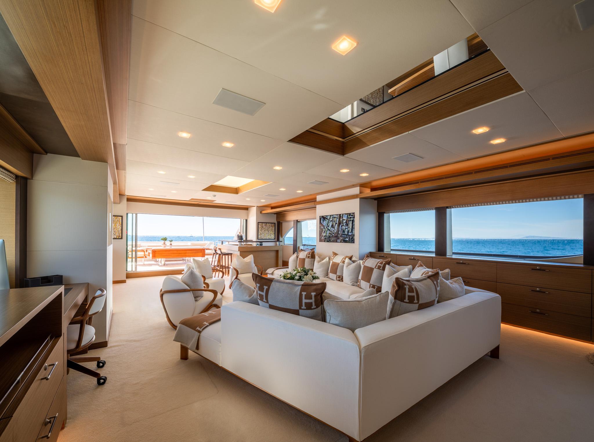 Luxurious yacht interior with ocean view, featuring elegant seating and modern design, custom 2008 model.