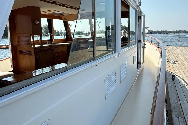  Yacht Photos Pics 1990 Grand Banks 42 Classic yacht, showcasing elegant interior and exterior design by the water.