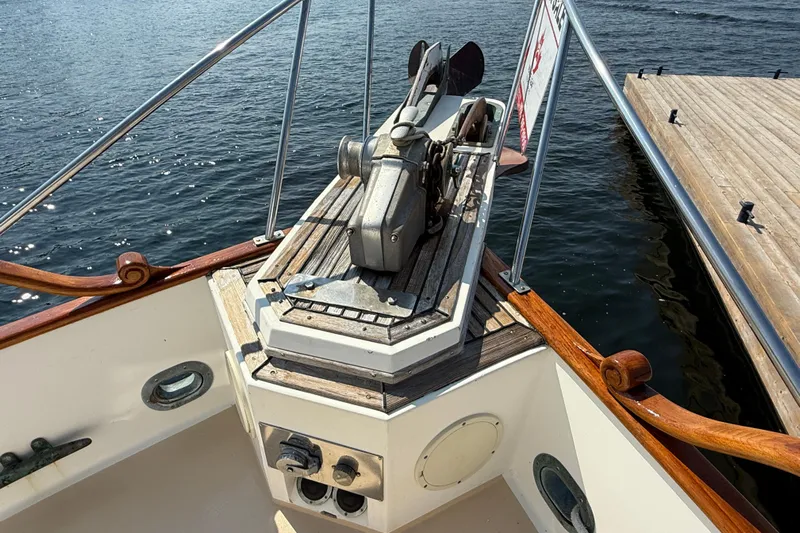  Yacht Photos Pics Bow of 1990 Grand Banks 42 Classic yacht with anchor and wooden deck details.