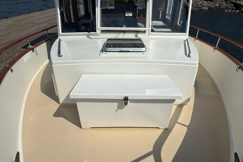  Yacht Photos Pics 1990 Grand Banks 42 Classic boat deck with storage box and railing.