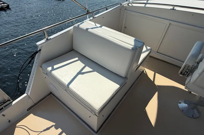  Yacht Photos Pics White seating area on 1990 Grand Banks 42 Classic yacht deck, overlooking water.