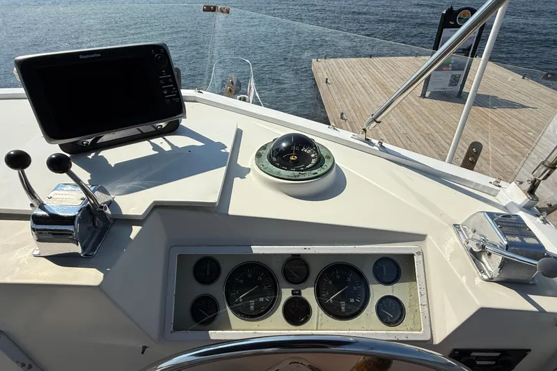  Yacht Photos Pics Helm of 1990 Grand Banks 42 Classic yacht with navigation instruments and controls.