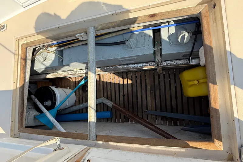  Yacht Photos Pics Open engine compartment of 1990 Grand Banks 42 Classic boat, showing equipment and tools.