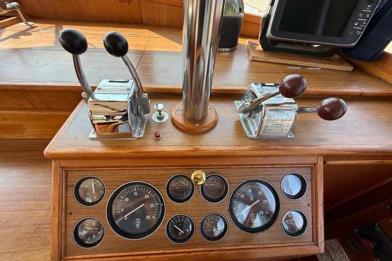  Yacht Photos Pics Control panel of a 1990 Grand Banks 42 Classic yacht with gauges and throttle levers.