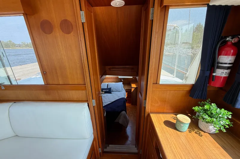  Yacht Photos Pics Interior of 1990 Grand Banks 42 Classic yacht with wooden finish and cozy cabin.