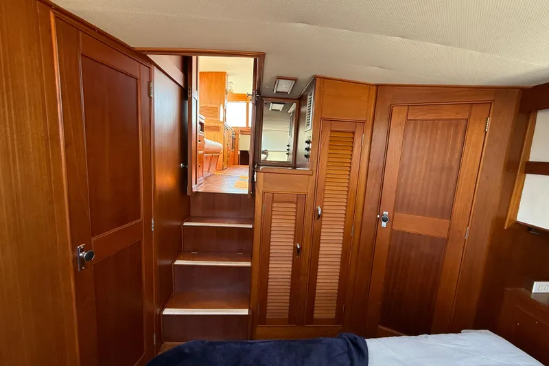 Yacht Photos Pics Interior of 1990 Grand Banks 42 Classic yacht with wooden cabinetry and stairs.