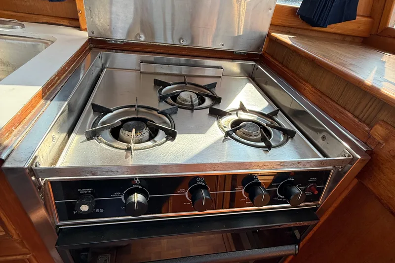  Yacht Photos Pics Stainless steel stove in 1990 Grand Banks 42 Classic yacht kitchen.
