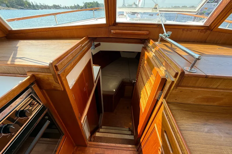  Yacht Photos Pics Interior view of 1990 Grand Banks 42 Classic yacht with wooden cabinetry and stairs.