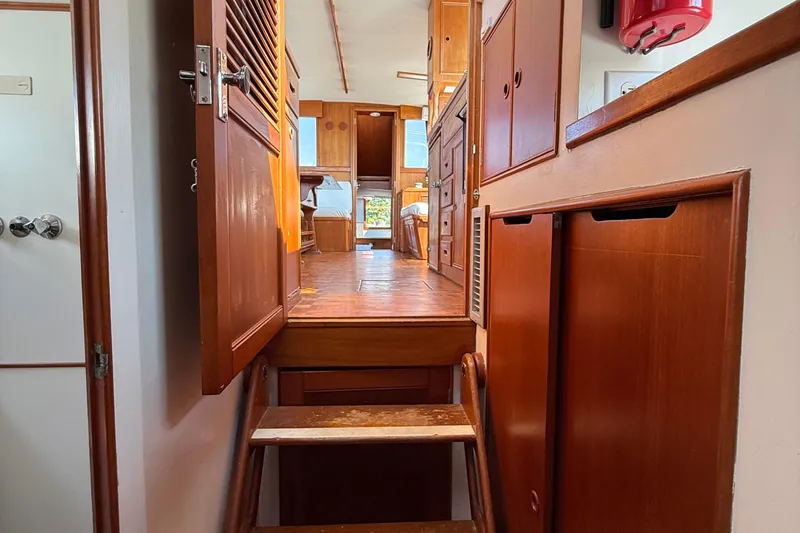  Yacht Photos Pics Interior of 1990 Grand Banks 42 Classic yacht with wooden cabinetry and stairs.