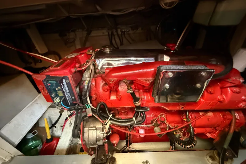  Yacht Photos Pics Engine compartment of a 1990 Grand Banks 42 Classic, featuring a red marine engine.