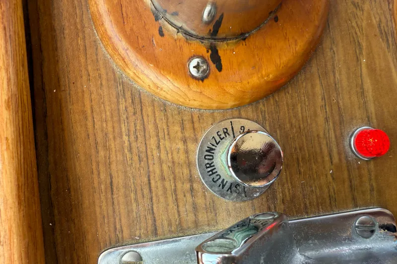  Yacht Photos Pics Close-up of a 1990 Grand Banks 42 Classic boat control panel with synchronizer knob.