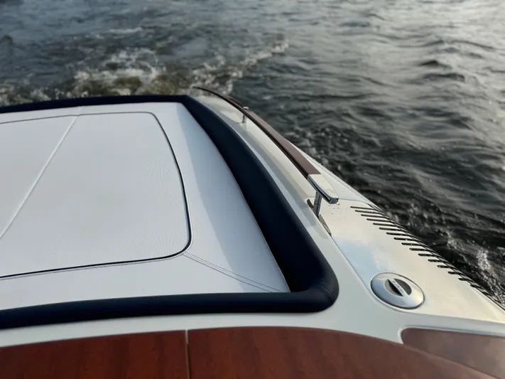 Amore Yacht Photos Pics 2015 Riva Aquariva Super boat cruising on water, showcasing sleek design and craftsmanship.