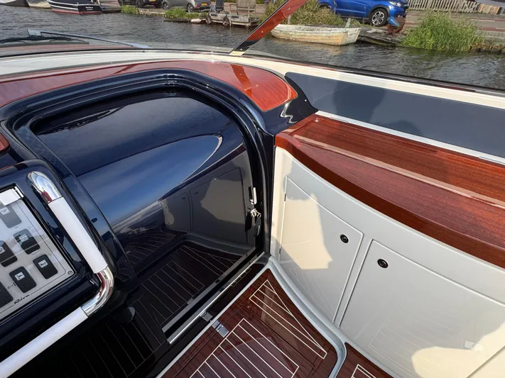 Amore Yacht Photos Pics Interior view of a 2015 Riva Aquariva Super boat with elegant wood and leather finishes.