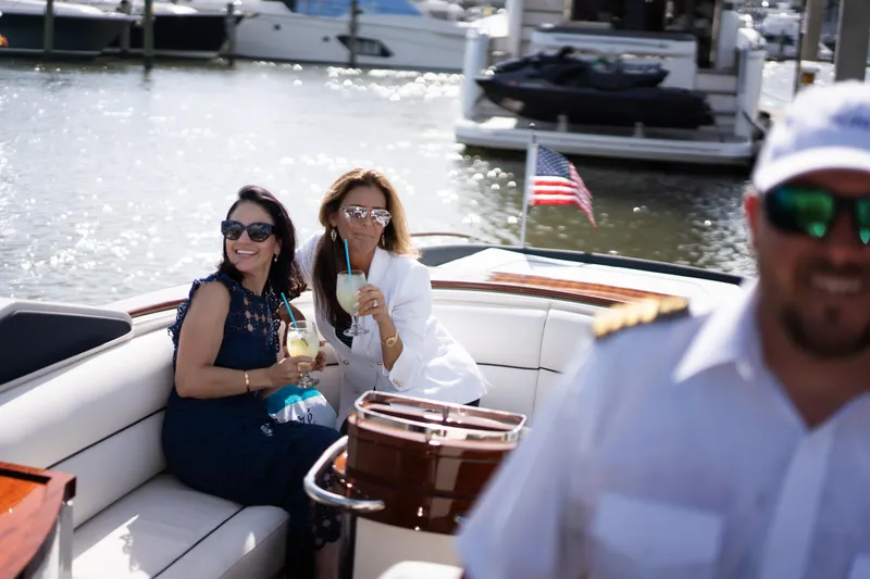 Amore Yacht Photos Pics Two women enjoying drinks on a 2015 Riva Aquariva Super yacht.