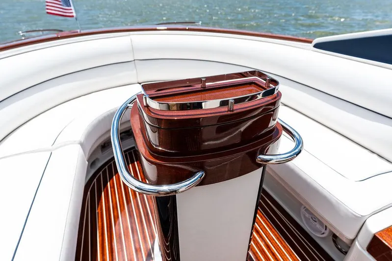 Amore Yacht Photos Pics 2015 Riva Aquariva Super boat interior with polished wood and white seating.