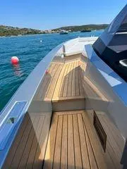  Yacht Photos Pics 2021 Wally Tender 48X yacht with sleek deck design on calm waters.
