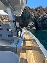  Yacht Photos Pics Wally Tender 48X yacht cruising near rocky coastline, 2021 model.
