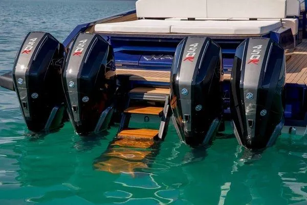  Yacht Photos Pics Four powerful outboard engines on a 2021 Wally Tender 48X yacht in clear blue water.
