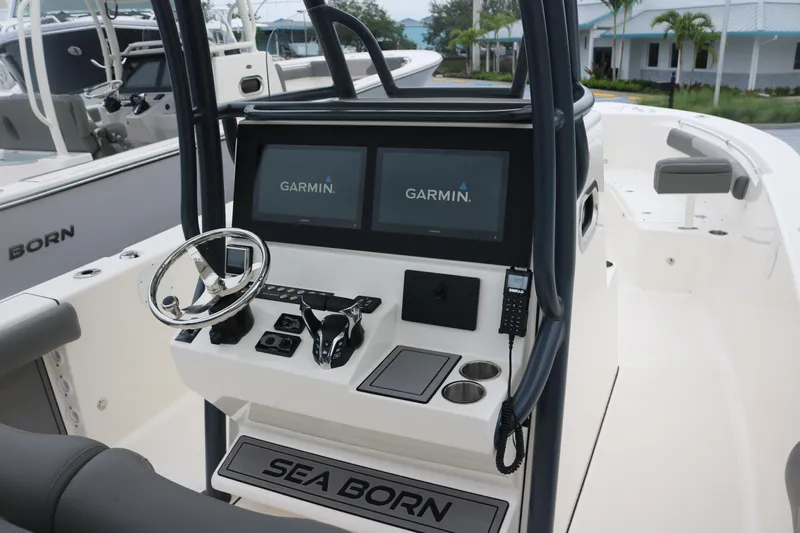  Yacht Photos Pics 2024 Sea Born LX 26 boat console with dual Garmin displays and steering wheel.