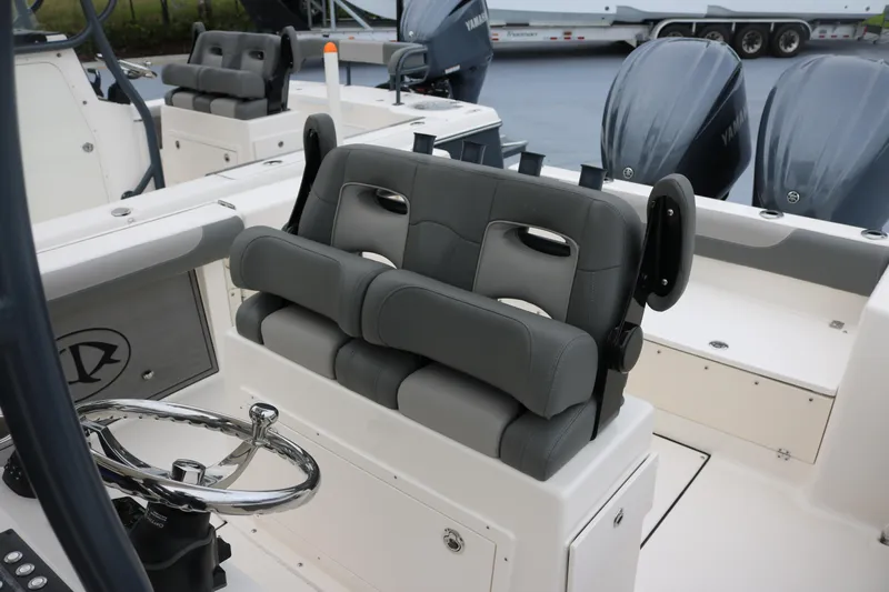  Yacht Photos Pics 2024 Sea Born LX 26 boat interior with dual seating and steering wheel.