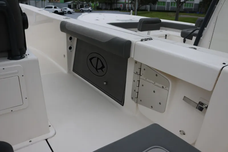  Yacht Photos Pics 2024 Sea Born LX 26 boat interior, featuring sleek white design and storage compartments.