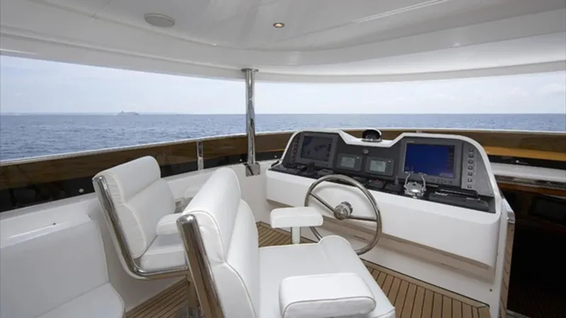 White Shark Yacht Photos Pics Luxury yacht helm with white seating, ocean view; Johnson 105, 2008 model.