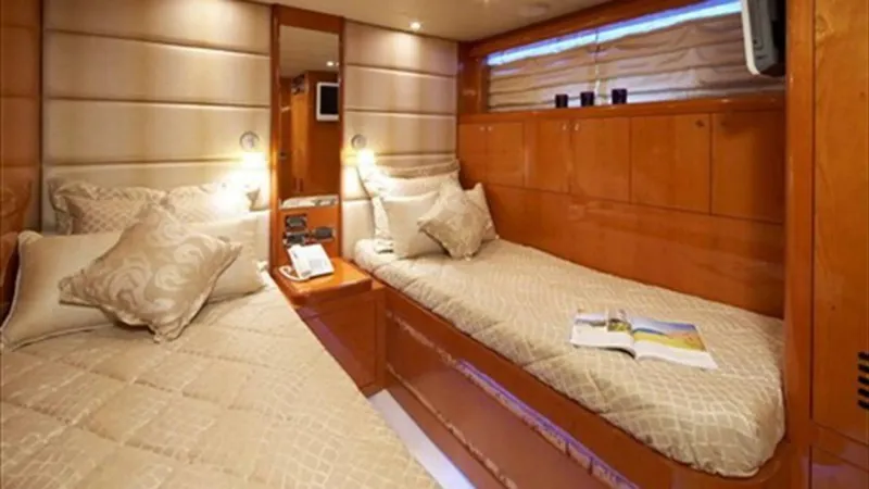 White Shark Yacht Photos Pics Luxurious cabin interior of 2008 Johnson 105 yacht with twin beds and elegant decor.