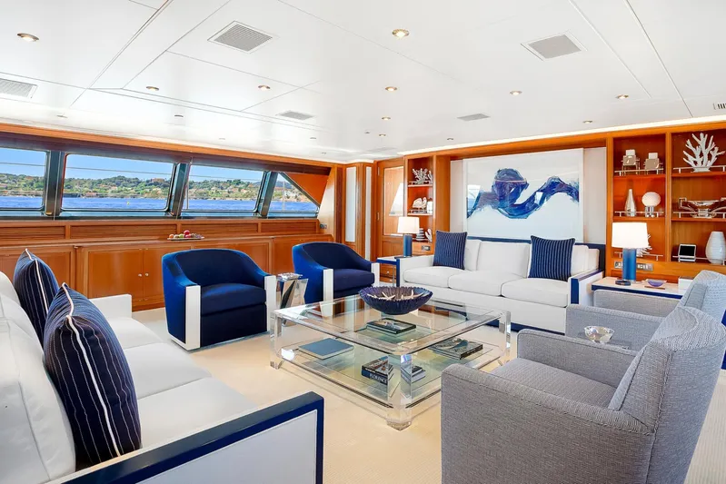 Zenji Yacht Photos Pics Luxurious yacht interior with elegant seating, modern decor, and large windows offering scenic views.
