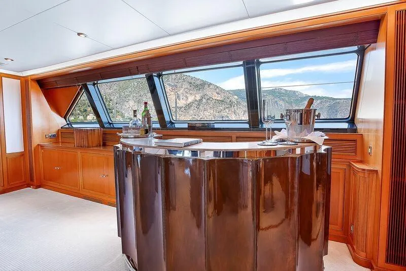 Zenji Yacht Photos Pics Luxurious interior of 2004 Perini Navi 56m yacht with elegant bar and scenic windows.