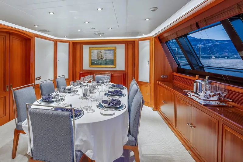 Zenji Yacht Photos Pics Luxurious dining area on 2004 Perini Navi 56m yacht with elegant table setting and ocean view.
