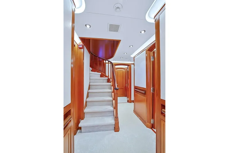 Zenji Yacht Photos Pics Luxurious interior of 2004 Perini Navi 56m yacht with elegant wooden staircase.