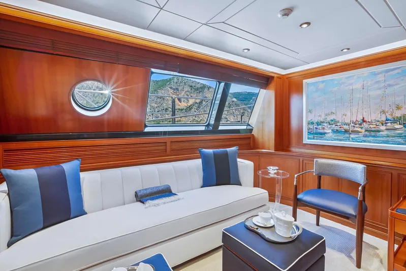 Zenji Yacht Photos Pics Luxurious interior of 2004 Perini Navi 56m yacht with elegant seating and nautical artwork.