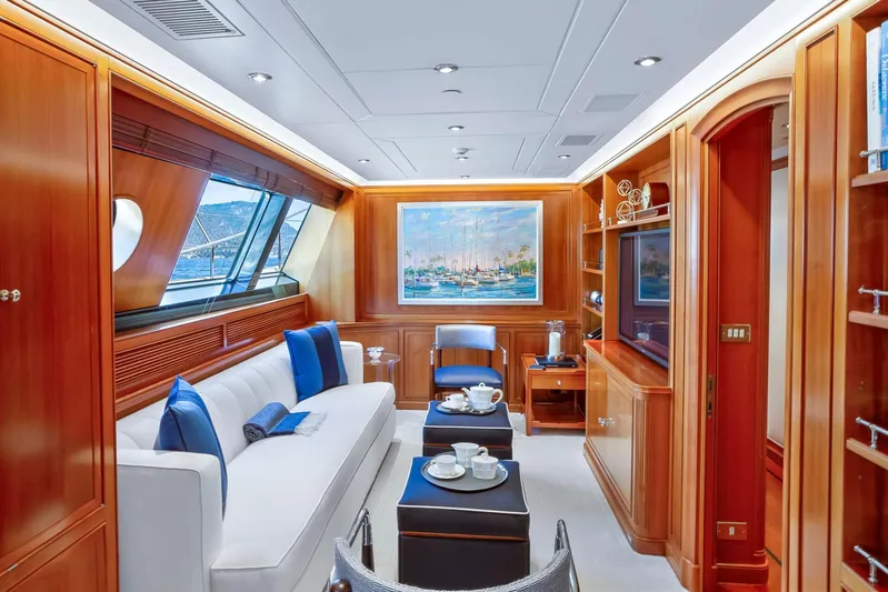 Zenji Yacht Photos Pics Luxurious interior of 2004 Perini Navi 56m yacht with elegant wood paneling and plush seating.