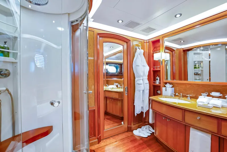 Zenji Yacht Photos Pics Luxurious yacht bathroom with wooden accents, featuring a shower and vanity. Perini Navi 56m, 2004.