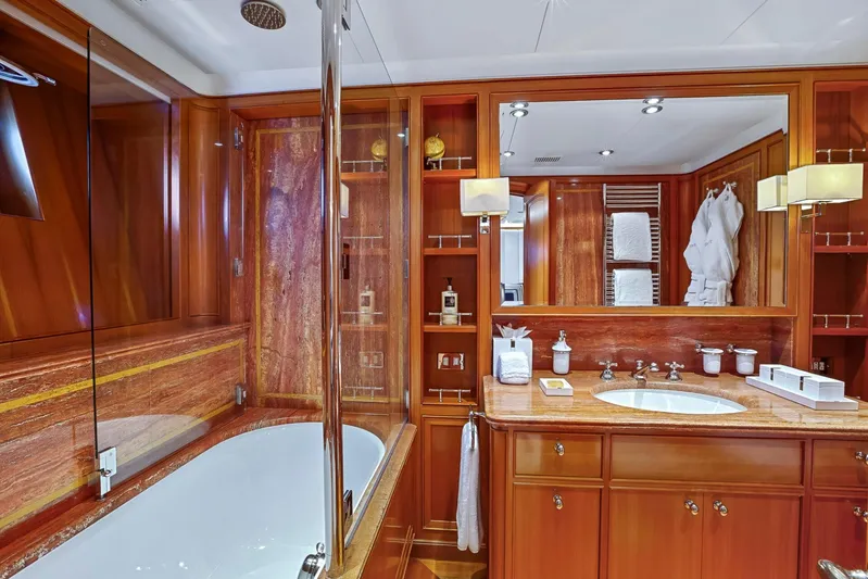 Zenji Yacht Photos Pics Luxurious wooden bathroom interior on 2004 Perini Navi 56m yacht, featuring elegant fixtures and amenities.
