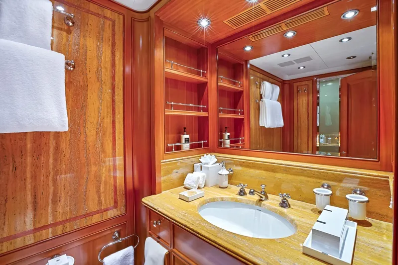 Zenji Yacht Photos Pics Luxurious yacht bathroom with wooden accents, elegant fixtures, and soft lighting on a Perini Navi 56m.