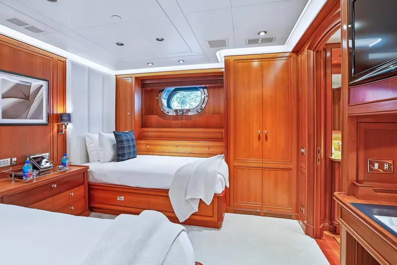 Zenji Yacht Photos Pics Luxurious cabin interior of 2004 Perini Navi 56m yacht with elegant wood finishes.