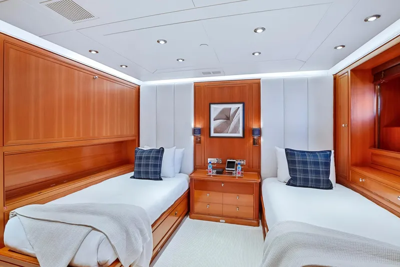 Zenji Yacht Photos Pics Luxurious twin cabin on 2004 Perini Navi 56m yacht with elegant wood paneling.