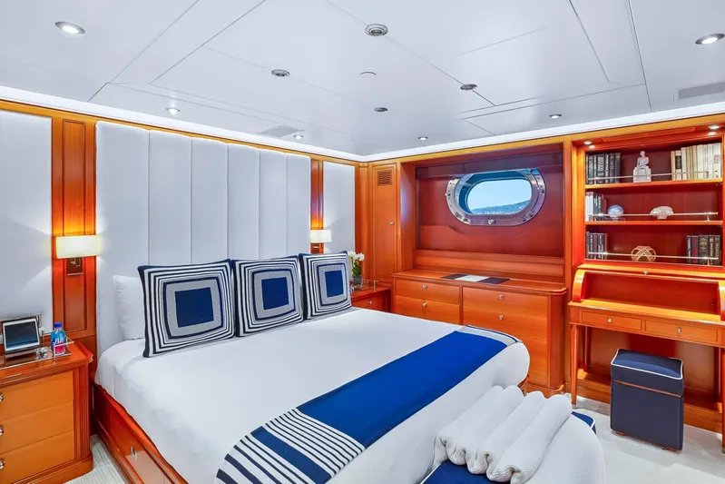 Zenji Yacht Photos Pics Luxurious cabin interior of 2004 Perini Navi 56m yacht with elegant wood and nautical decor.
