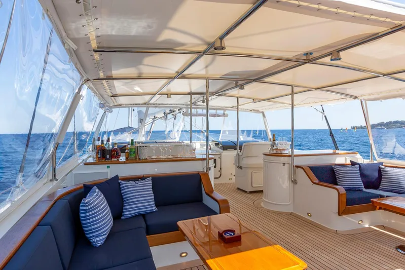 Zenji Yacht Photos Pics Luxurious 2004 Perini Navi 56m yacht interior with elegant seating and ocean view.