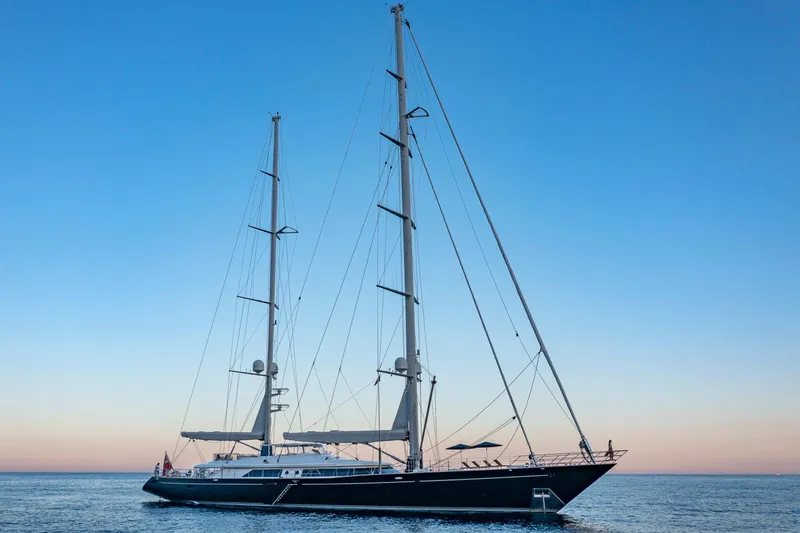 Zenji Yacht Photos Pics Luxury Perini Navi 56m yacht from 2004 sailing at sunset.