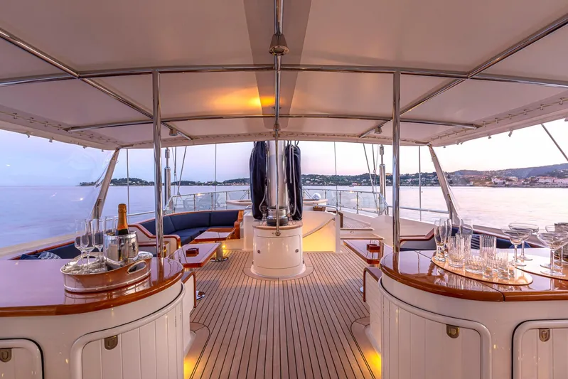Zenji Yacht Photos Pics Luxurious deck of 2004 Perini Navi 56m yacht with elegant seating and ocean view.