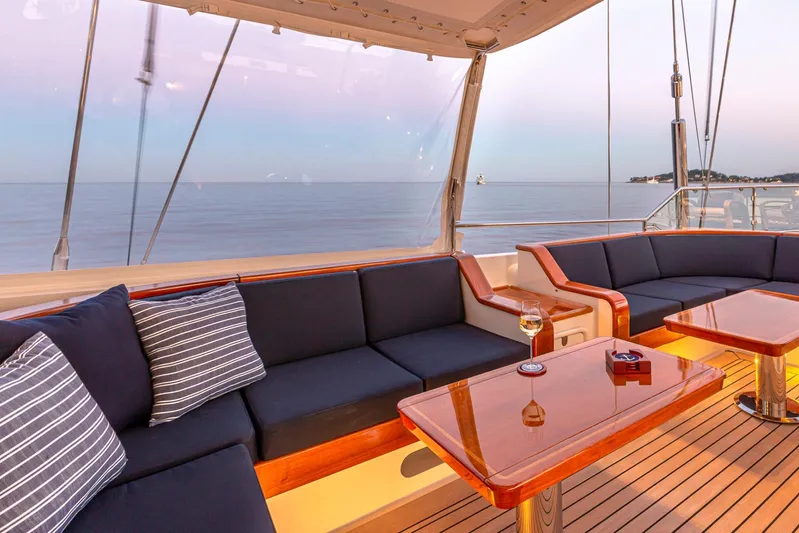 Zenji Yacht Photos Pics Luxurious deck seating on 2004 Perini Navi 56m yacht with ocean view.