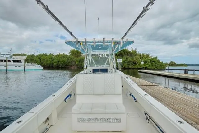  Yacht Photos Pics 2015 Invincible 36 boat docked, featuring spacious seating and sleek design.