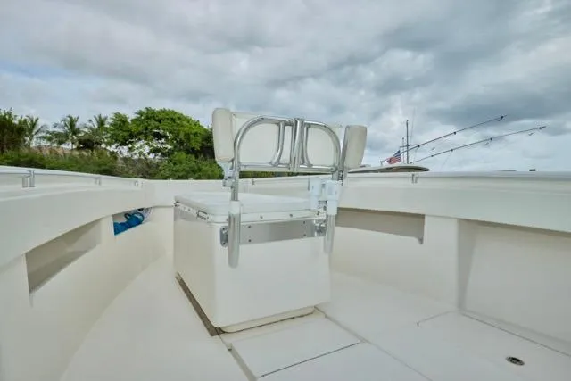  Yacht Photos Pics 2015 Invincible 36 boat deck with seating, under cloudy sky.
