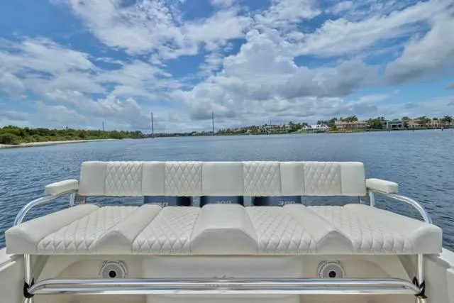  Yacht Photos Pics Invincible 36 boat, 2015 model, featuring white seating with scenic water view.
