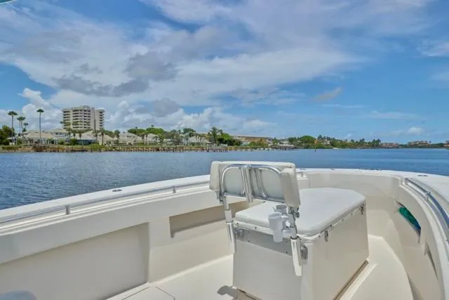  Yacht Photos Pics Invincible 36 boat, 2015 model, cruising on a sunny day with coastal view.