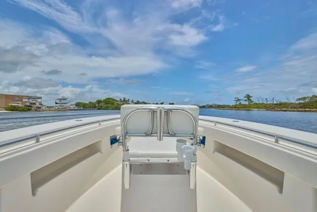  Yacht Photos Pics Invincible 36 boat, 2015 model, cruising on a sunny day with clear skies.